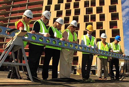 Photo of officials at the Lake & Forest project topping-off ceremony